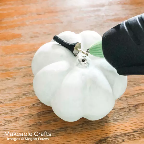 painting dollar store pumpkins | hot glue your stems back on