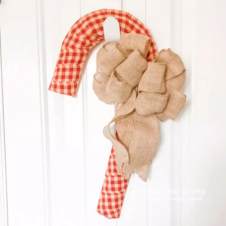 I am LOVING candy cane door decorations and today I am showing you how to make your own!