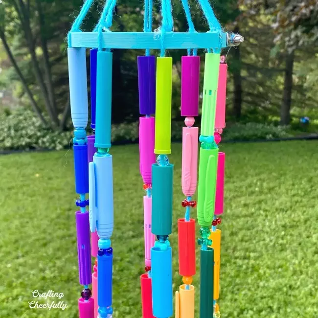 Recycled crafts from old orpahned pen caps - easy for the kids and colorful for the yard!