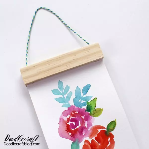 Recycled crafts do NOT have to be "old" - see how to make this colorful floral scroll art in minutes!