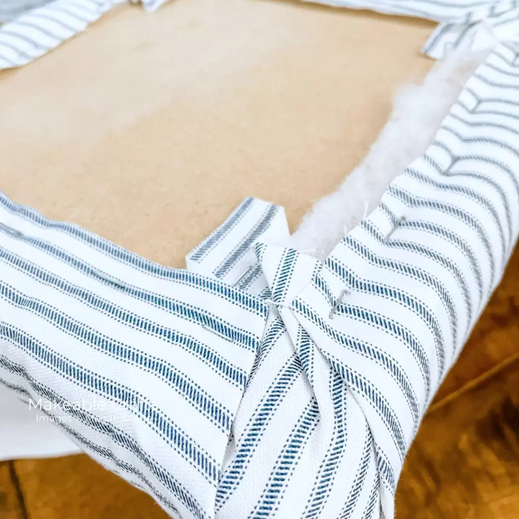 how to reupholster a footstool - covering with fabric